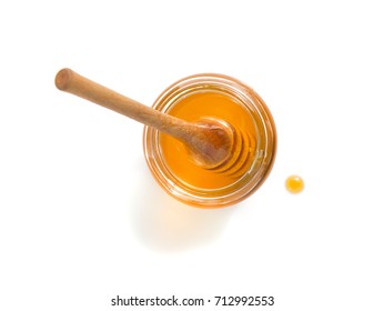 Glass Jar Of Honey Isolated On White Background