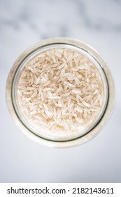 Glass Jar With Jasmine Rice Close-up Shot From Top Down Perspective, Healthy Pantry Ingredients And Staples