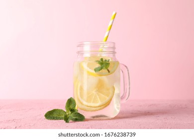 Glass Jar With Lemonade On Pink Background. Fresh Drink