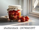 Glass jar with pickled tomatoes