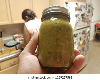 Glass Jar Of Puerto Rico Condiment Called Sofrito In Kitchen