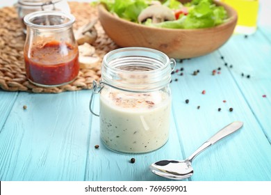 Glass Jar With Ranch Salad Dressing On Table