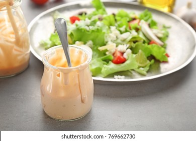 Glass Jar With Ranch Salad Dressing On Table