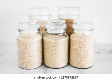 Glass Jar With Rice Of Different Varieties Including Jasmine Basmati Arborio Sushi And Brown Rice, Healthy Pantry Ingredients And Staples