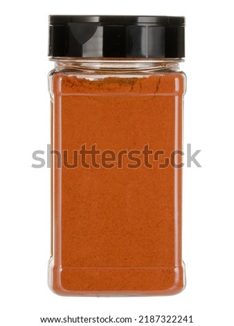 Glass jar with spices isolated on a white background.