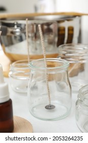 Glass Jar With Wick On White Kitchen Table. Making Homemade Candle