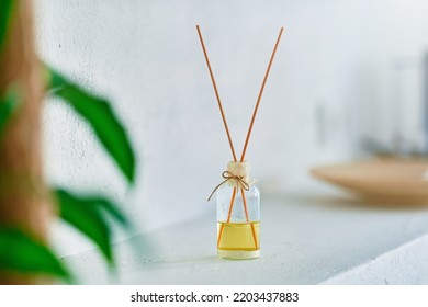 Glass Jar With Wooden Aroma Sticks In Home Interior 