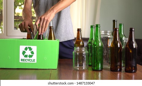 Glass Jars And Bottles Recycling Bin.  Sort Recycling At Home: Glass, Compost, Paper, And Plastic