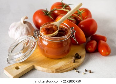 Glass Jars With Canned Vegetables Red Canned Lecho In A Glass Jar Raw Tomatoed Pepper Garlic Above