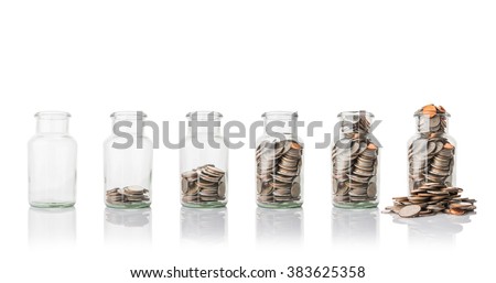 Glass jars with coins, savings concept