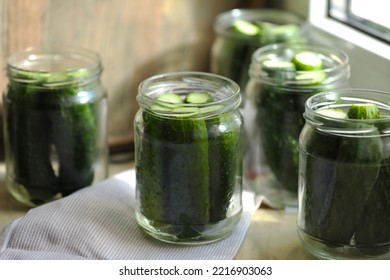 Glass Jars With Fresh Cucumbers On Table, Closeup. Canning Vegetables