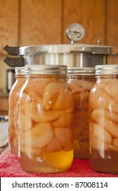 Glass Jars Of Home Canned Pears With A Pressure Cooker