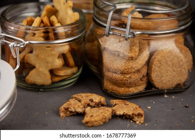 Glass Jars With Homemade Cookies. Crumbled Cookie On A Kitchen Table. Homemade Cakes, Shortbread And Biscuit Dough. Cooking, Still Life. Food At Home. Cookie With Coconut Flakes. Chocolate Chip Cake. 