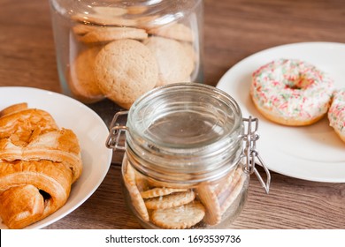 Glass Jars With Homemade Cookies. Crumbled Cookie On A Kitchen Table. Homemade Cakes, Shortbread And Biscuit Dough. Cooking, Still Life. Food At Home. Cookie With Coconut Flakes.