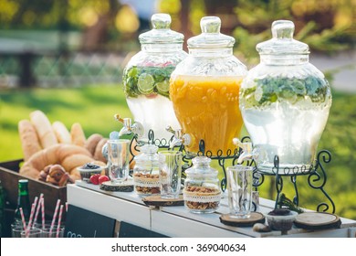 Glass jars of lemonade on wedding candy bar