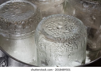 Glass Jars In The Stainless Steel Pot During Steam Sterilization For The Home Canning, Fragment Close-up
