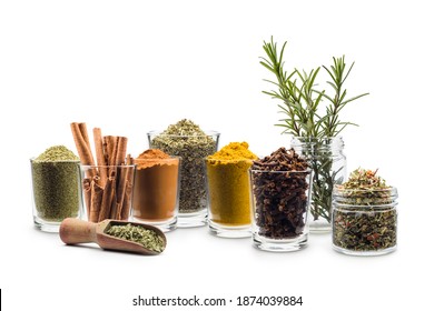 glass jars with various spices on white background
