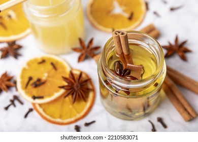 Glass Jars With Wax On A Wooden Table. Handmade Spiced Candles. Ecological And Vegan Handmade Soy Wax Candles. Space For Text. Handmade Candle.Winter And Autumn Decor For Comfort.