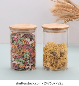 glass jars with wooden lids on blue background. Variety of colorful grain, Farfalle in a glass jar isolated on a white background. High quality photo, Fusilli pasta in a glass jar,  - Powered by Shutterstock