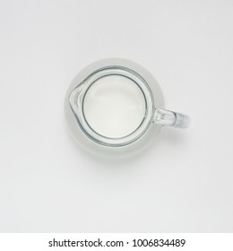 Glass Jug With Milk On White Background, Top View