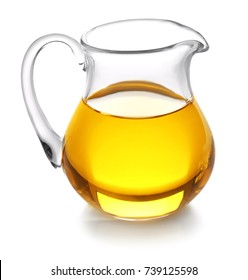 Glass jug with oil on white background