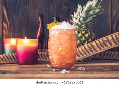 Glass Of Jungle Bird Cocktail Garnished With Pineapple Wedge