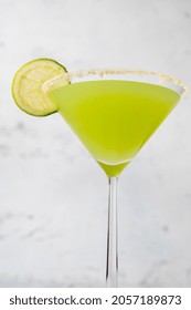 Glass Of Key Lime Pie Martini Cocktail Garnished With Lime Slice