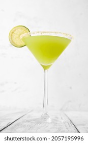 Glass Of Key Lime Pie Martini Cocktail Garnished With Lime Slice