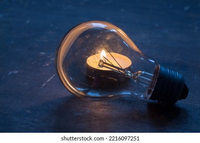 Glass Lamp On The Background Of A Candle. Blackout In Ukraine Due To War