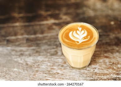 Glass Of Latte Coffee On Wooden Vintage Table.