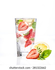 Glass Of Lemonade With Lemon, Lime And Mint On White Background