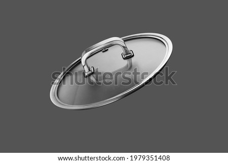 Glass lid from a pan isolated on grey background
