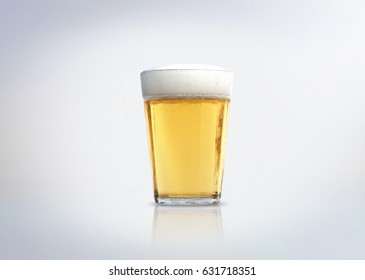 Glass Of Light Lager Beer With Foam. Isolated On White Background.