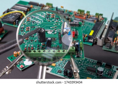 A Glass Magnifier With A Focus On Electronic Waste Printed Circuit Board. Impact Of E-waste On The Environmental System.