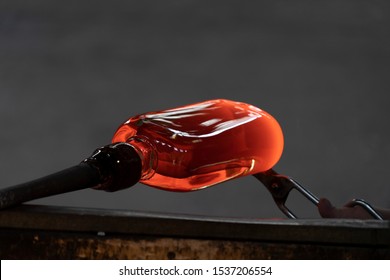 glass master while working in Murano furnace glass factory Venice Italy close up detail - Powered by Shutterstock