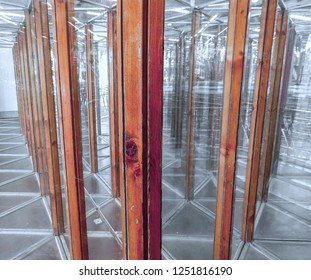 A Glass Maze On An Amusement Funfair, Seeking The Way Out In A House Of Mirrors, Copy Space, Selected Focus 