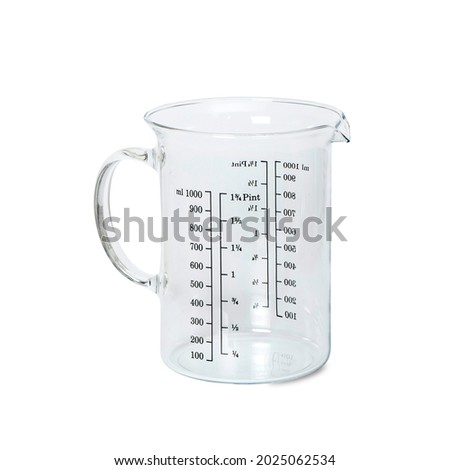 Glass measuring cup, insulated on a white background.