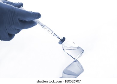 Glass Medicine Vial And Botox, Hualuronic, Collagen Or Flu Syringe On A White Background