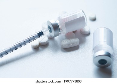 Glass Medicine Vial And Pills, Glass Medicine Vial And Botox Syringe, Vaccination And Immunization