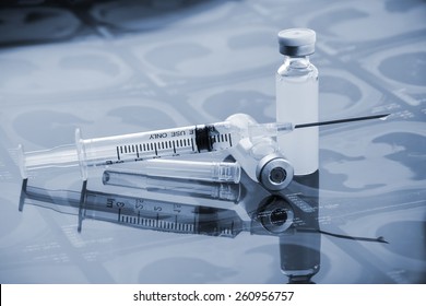 Glass Medicine Vials with botox, hualuronic, collagen or flu Syringe  (shallow DOF)