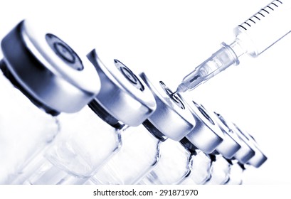 Glass Medicine Vials And Botox Hualuronic Collagen Or Flu Syringe. Tinted Image.