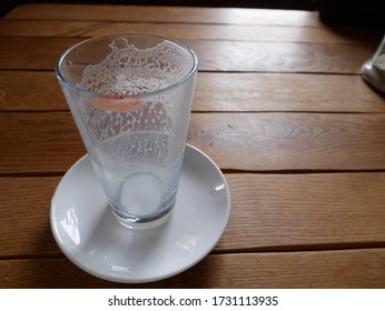 Glass Of Milk Finished Drinking, Red Lipstick Mark On A Glass