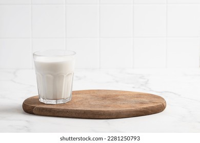 Glass of milk on a light background - Powered by Shutterstock