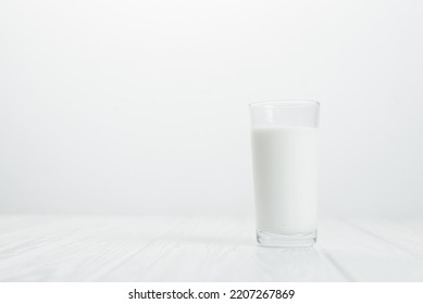 A Glass Of Milk On A White Background. Benefits Of Milk