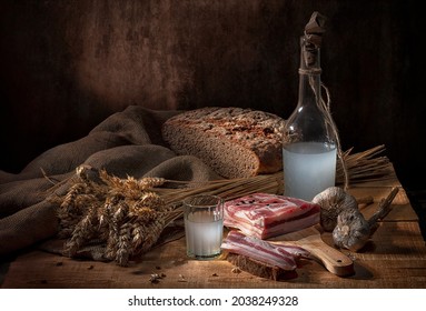 A Glass Of Moonshine With Salted Lard And A Bottle