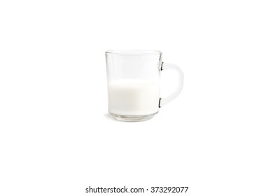 Glass Mug Half Full Of Milk On A White Background