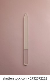 Glass Nail File On Pink Background. Top View.