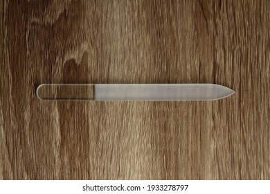 Glass Nail File On Wooden Background. Top View.