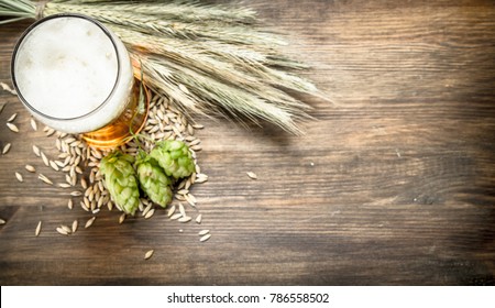 glass of natural beer. On a wooden table.