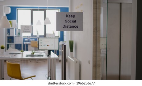 Glass Office Dor With Keep Social Distance Poster On It, Modern Office Stairs Duting Covid 19 Coronavirus Pandemic, Global Economic Crisis